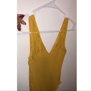 Yellow lace body suit